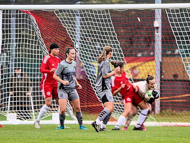 Chloe Gormley and Riley Whale in attendance as debut keeper Lottie Behan brushes off some physical stuff to keep hold of the ball