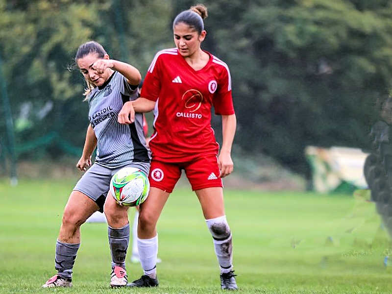 Jordan Feldman tussling with a Welling Utd defender