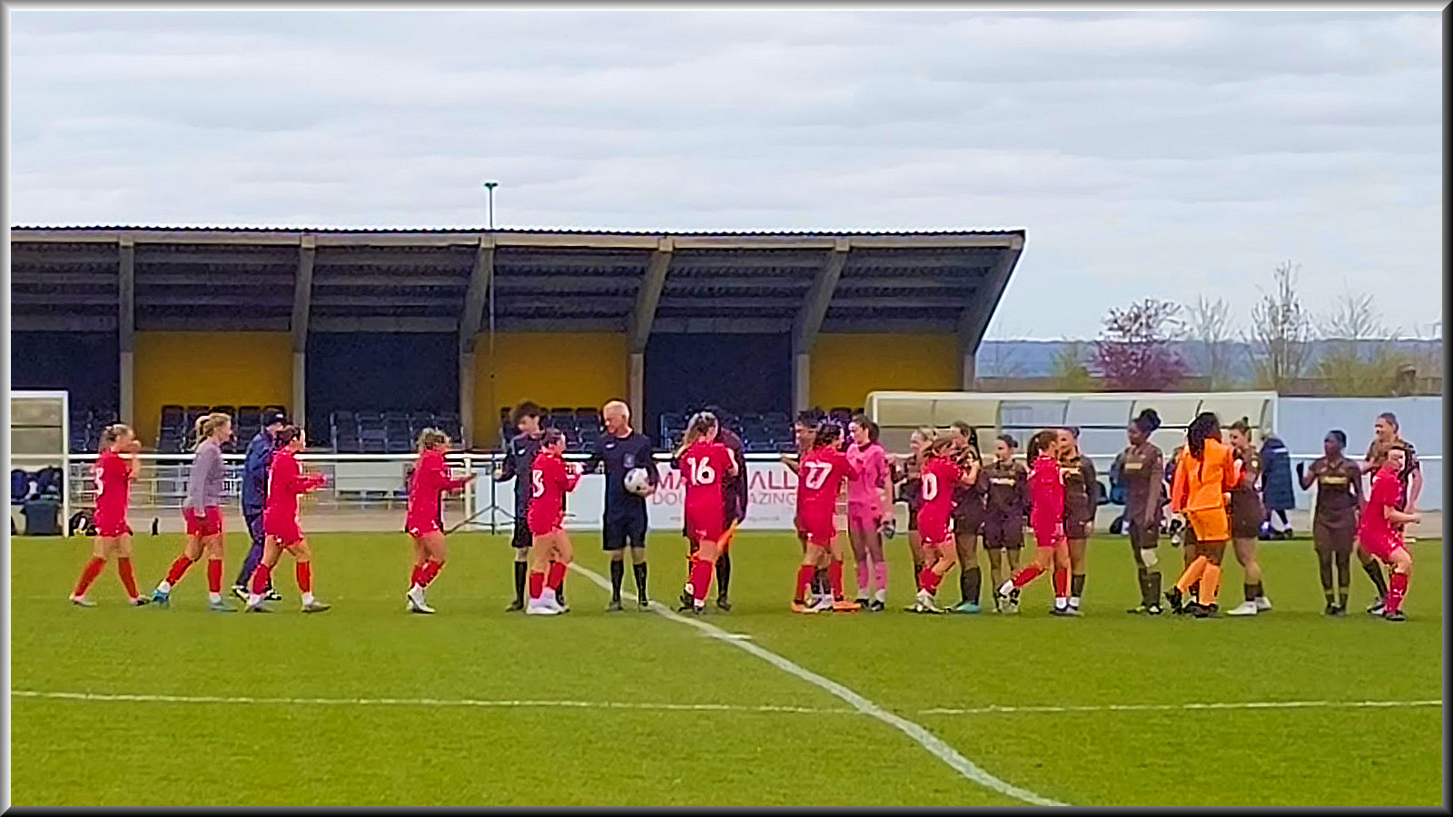 Two teams, officials, coach... all freezing and wanting to get the game going at Cheshunt.