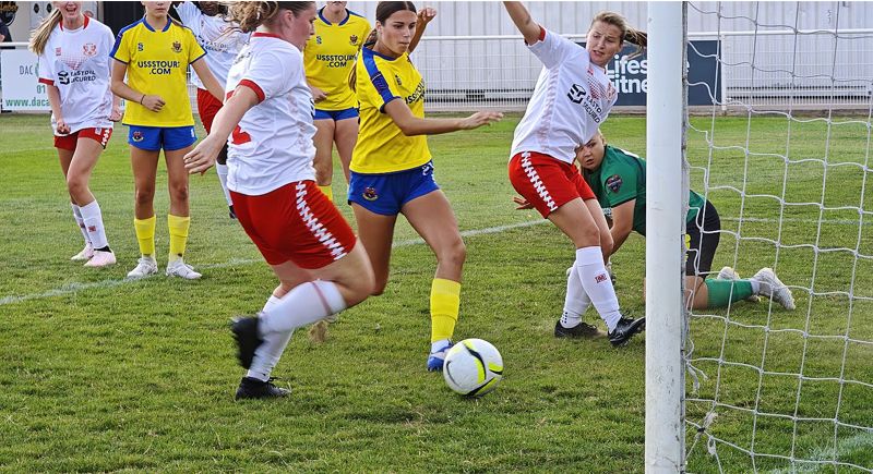 Beth Brogan (centre) reacts first to put Sunday's result against AFC Sudbury beyond doubt